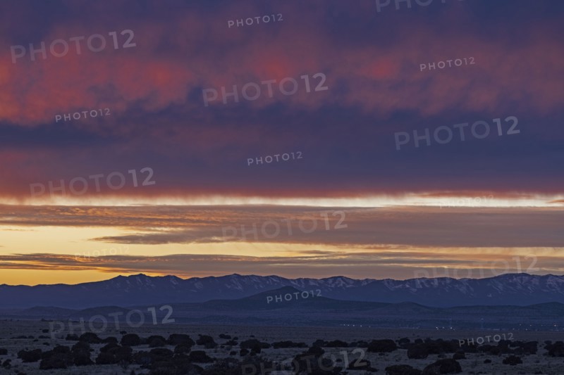 Dramatic sunset sky over Cerrillos Hills State Park desert landscape
