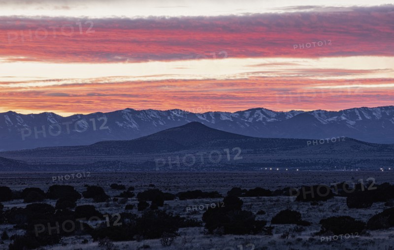 Dramatic sunset sky over Cerrillos Hills State Park desert landscape