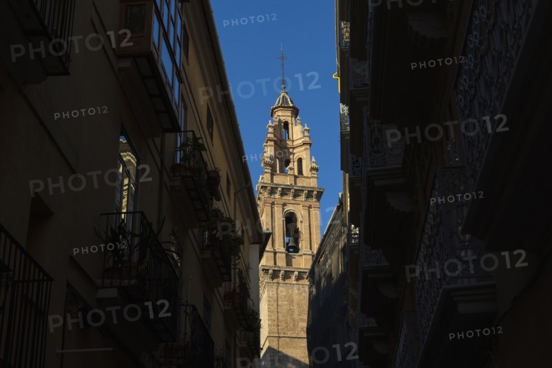 Church bell tower and old town buildings
