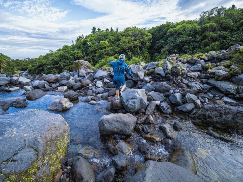 Hiker crossing river