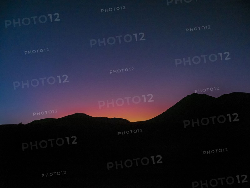 Silhouette of mountain ridge at sunset