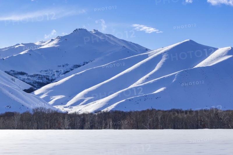 Winter landscape with snowy mountains