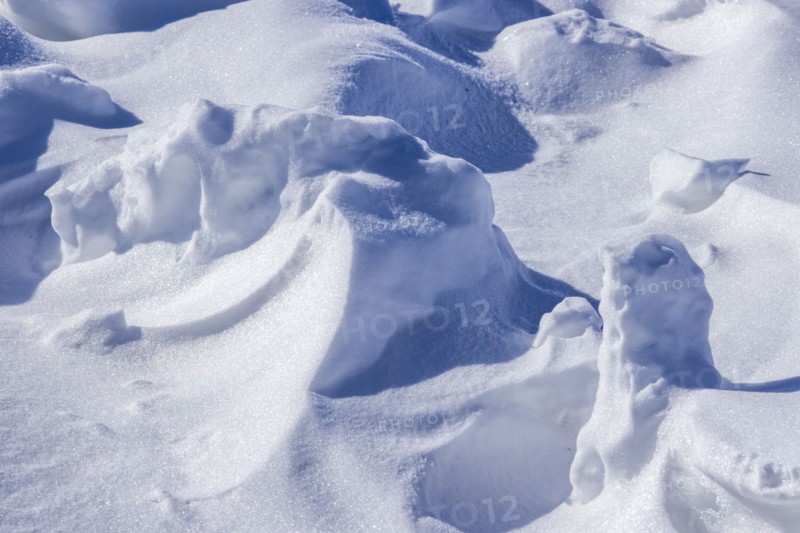 Close-up of snow formations on sunny day
