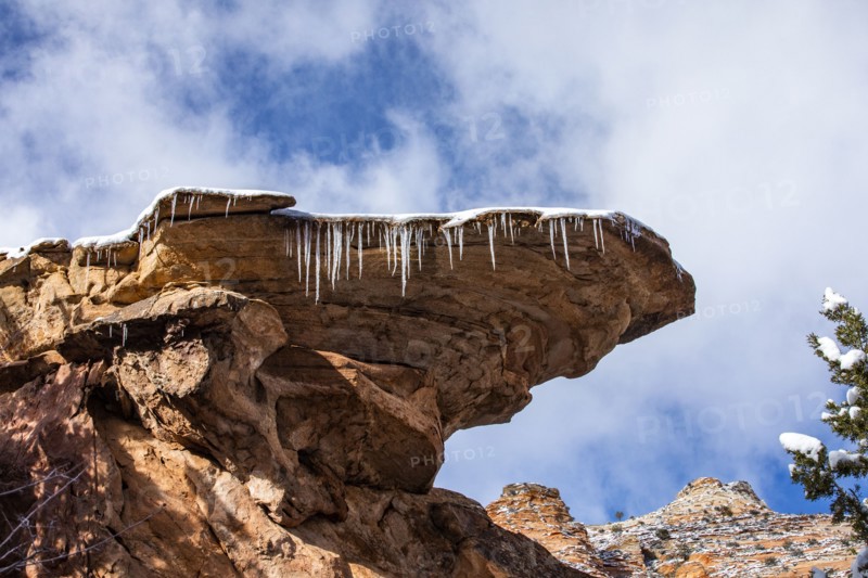 Icicles hanging from rock in mountains