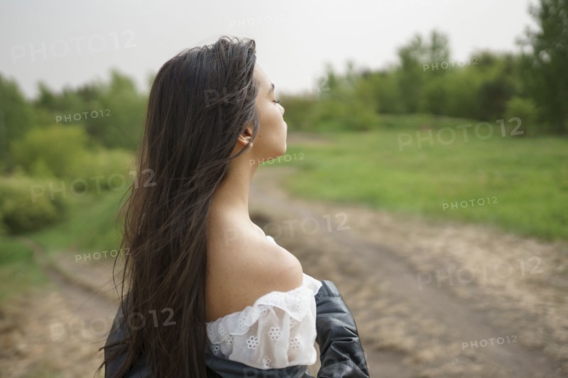 Portrait of teenage girl standing in nature