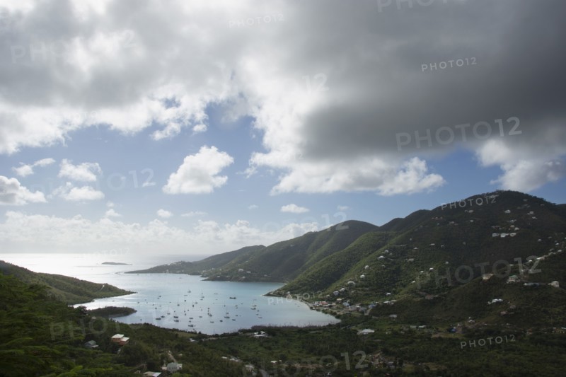 Thick clouds over Coral Bay with sailboats