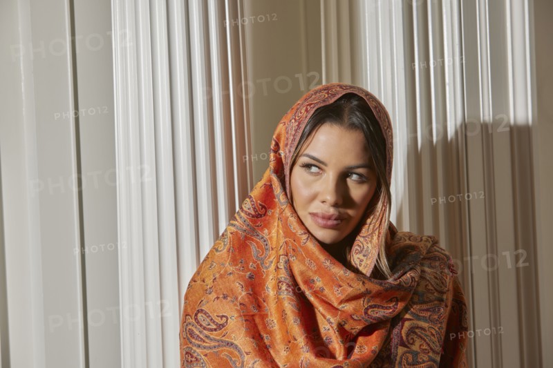Portrait of woman wrapped in shawl