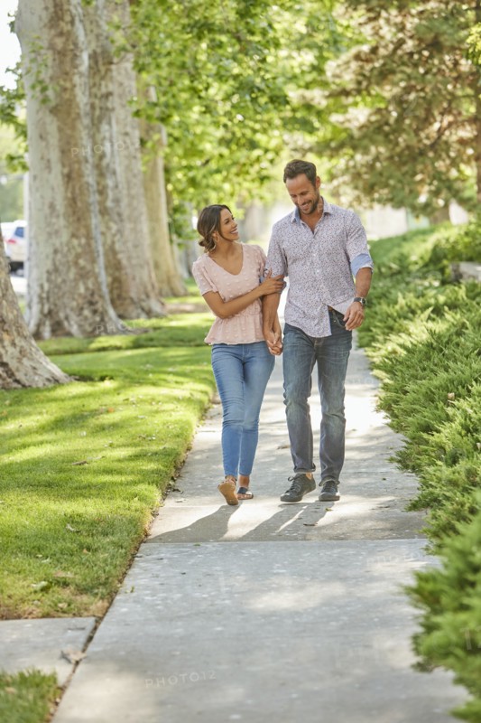 Smiling couple holding hands