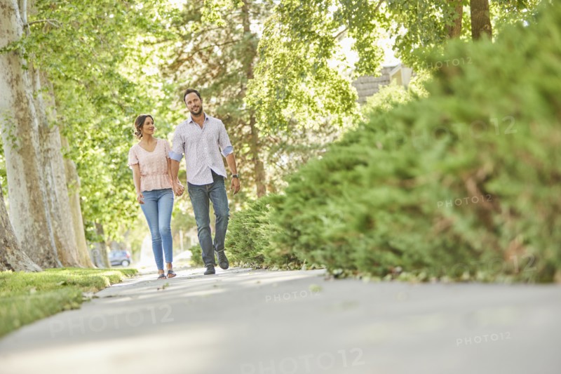 Smiling couple holding hands