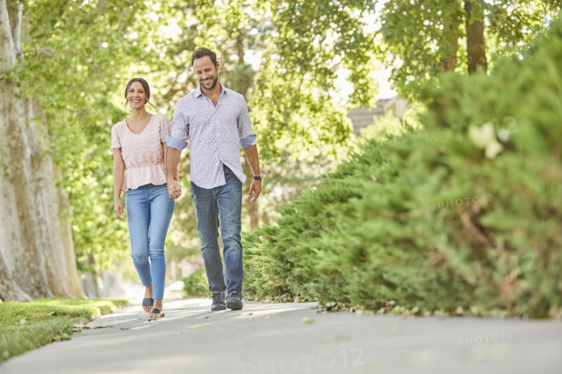 Smiling couple holding hands
