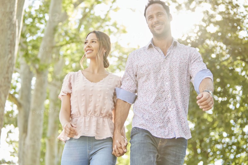 Smiling couple holding hands