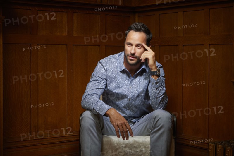 Mid adult man sitting on chair