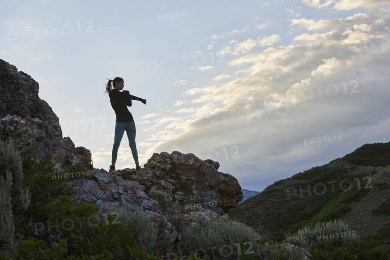 Mid adult woman hiking in mountains