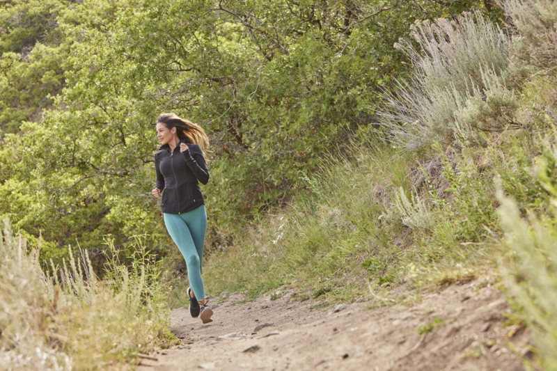 Mid adult woman jogging outdoors