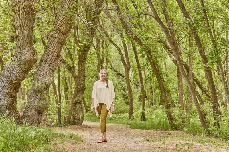 Smiling mature woman walking in park