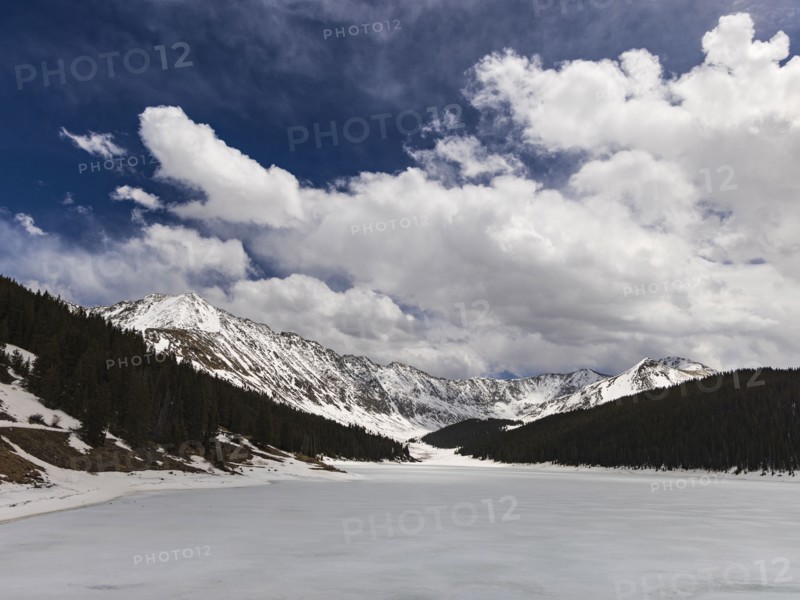 Snowy Rocky Mountains landscape on sunny day