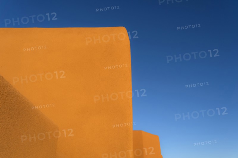 Adobe walls against blue sky