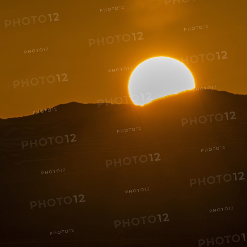 Setting sun seen above mountains near Sun Valley