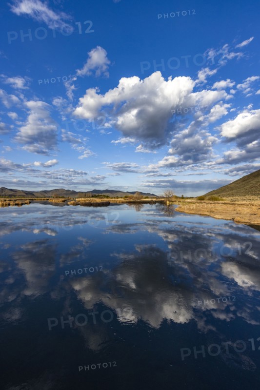 Clouds reflecting in lake near Sun Valley