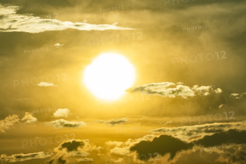 Sky with clouds and setting sun