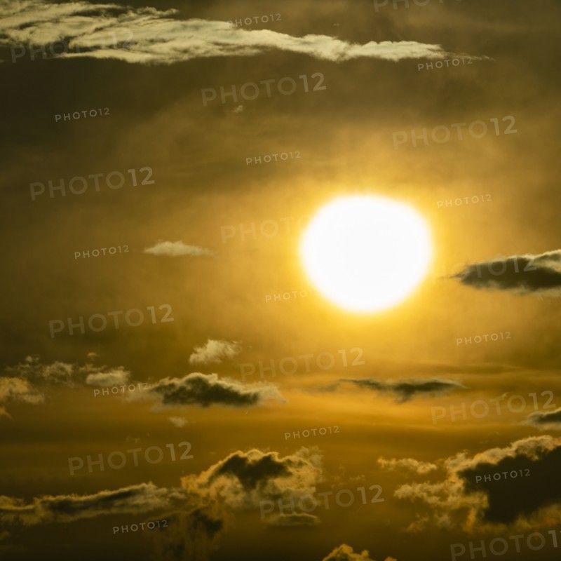 Sky with clouds and setting sun