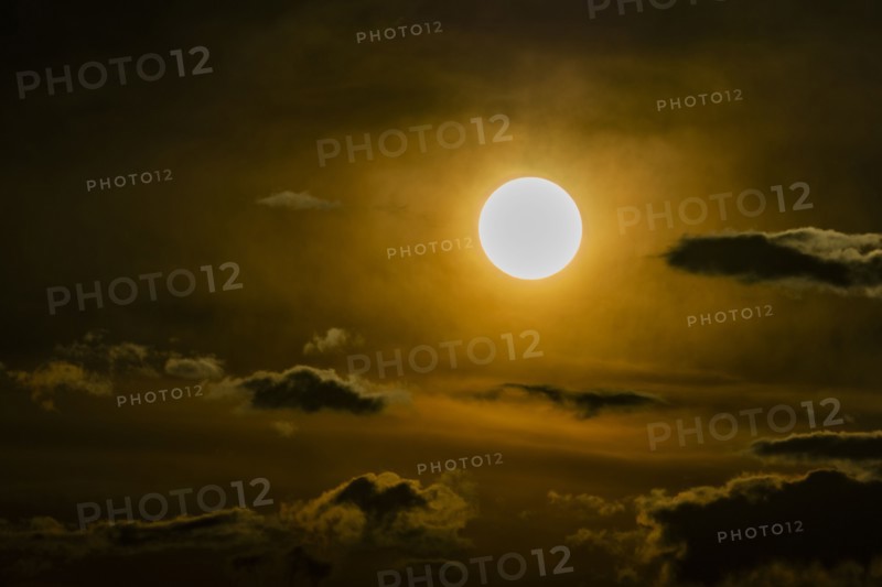 Sky with clouds and setting sun