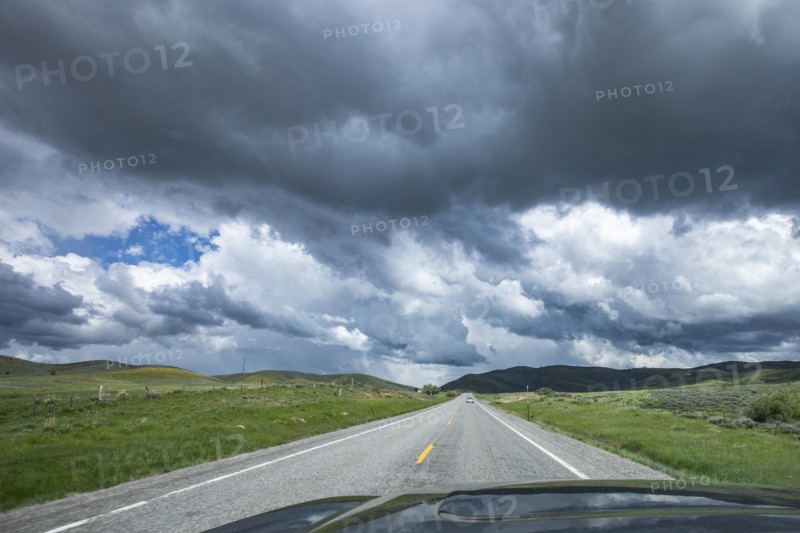 Storm clouds gathering above highway