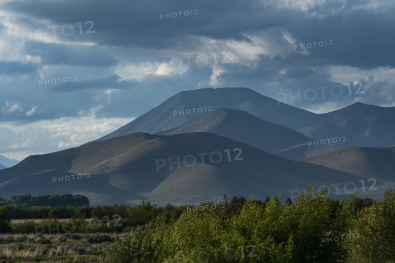 Clouds above mountains at sunset
