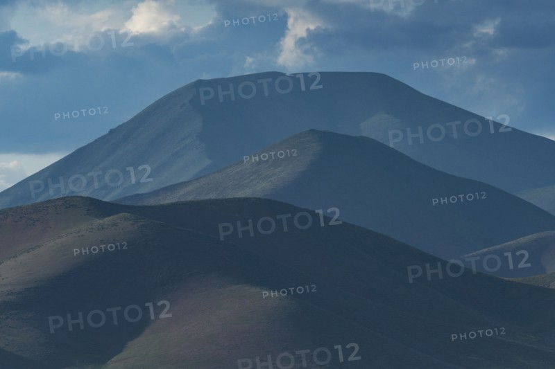 Clouds above mountains at sunset