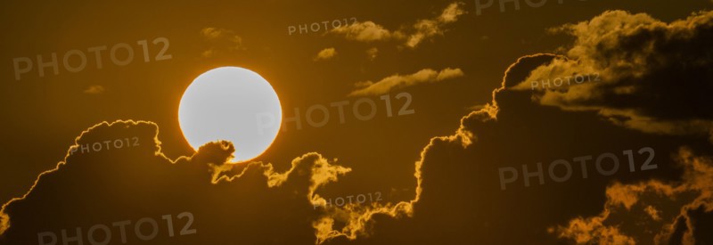 Sky with clouds and setting sun