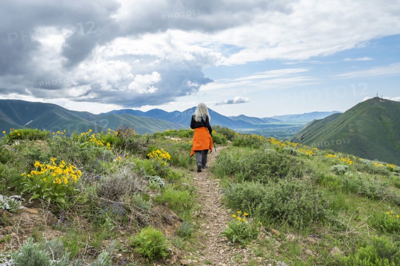 Senior blonde woman hiking on Carbonate Mountain trail