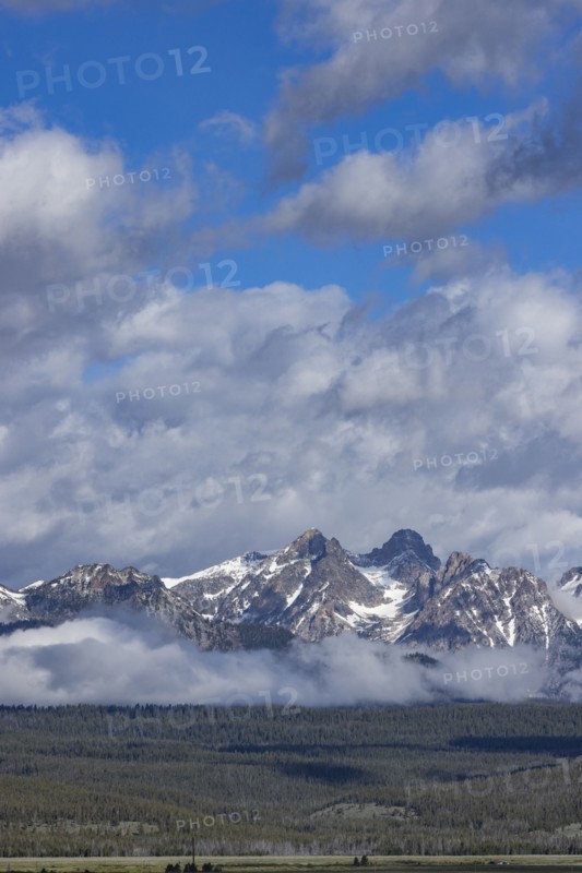 Fog over forest by Sawtooth Mountains
