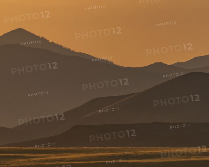 Scenic view of mountain landscape at sunset