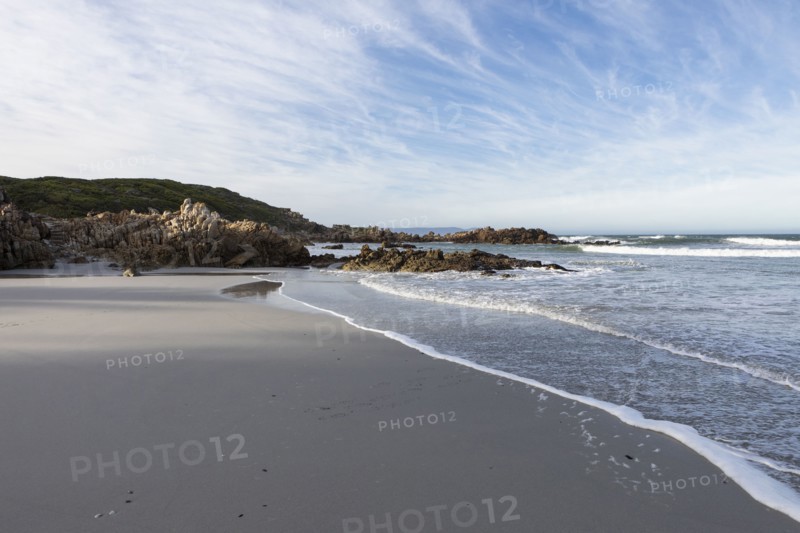 Sandy coastline of Atlantic Ocean in Voelklip Beach