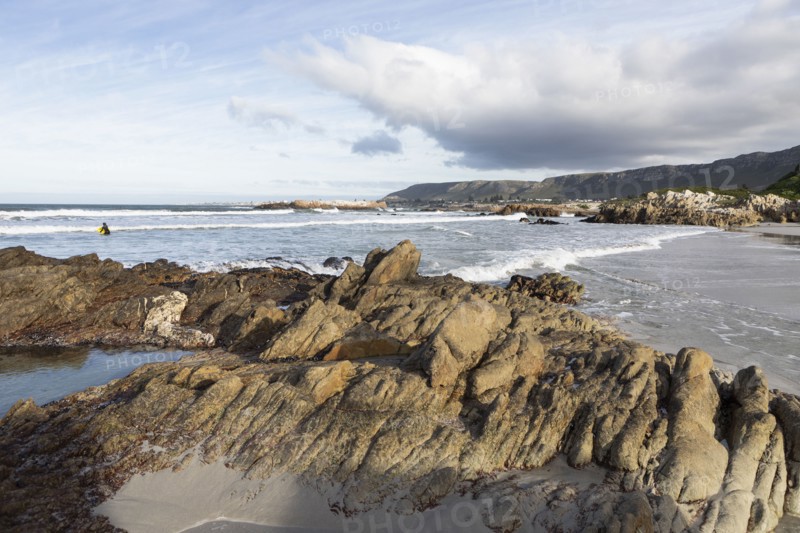 Distant view of boy bodyboarding