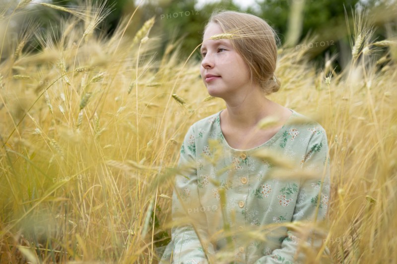 Young woman in wheat field