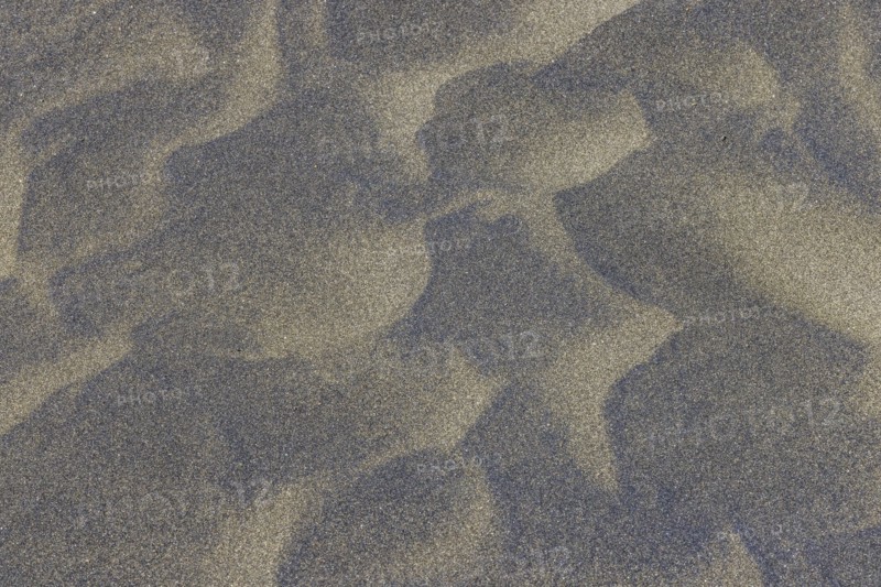Wind sculpted patterns in beach sand