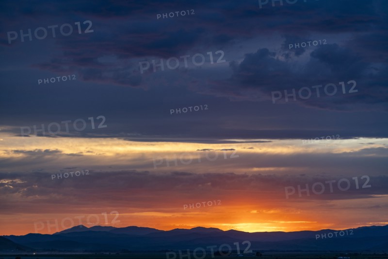 Beautiful sunset over silhouettes of mountains