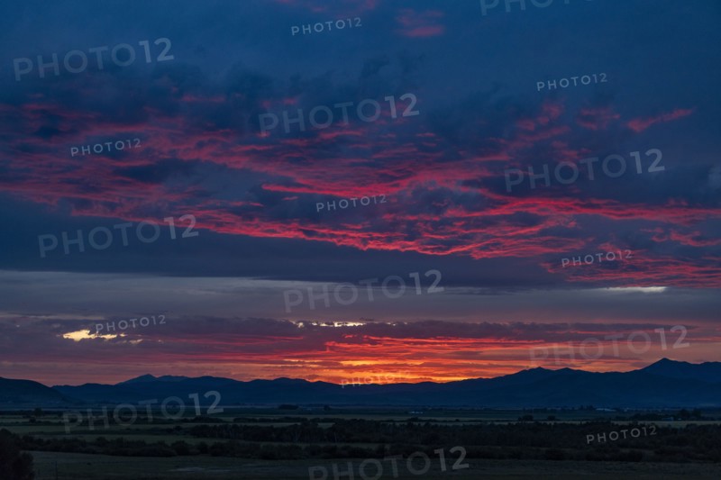 Beautiful sunset over silhouettes of mountains