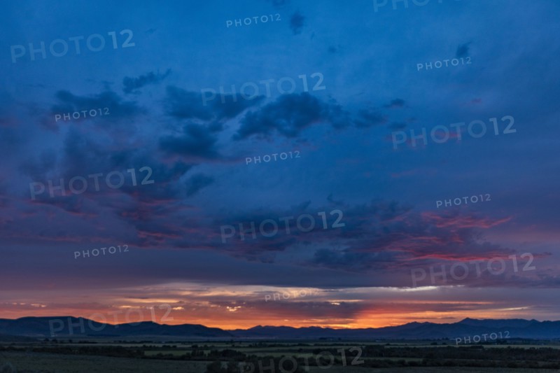 Beautiful sunset over silhouettes of mountains