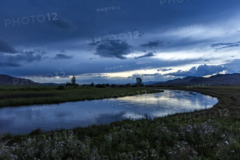Reflection of evening storm in Silver Creek