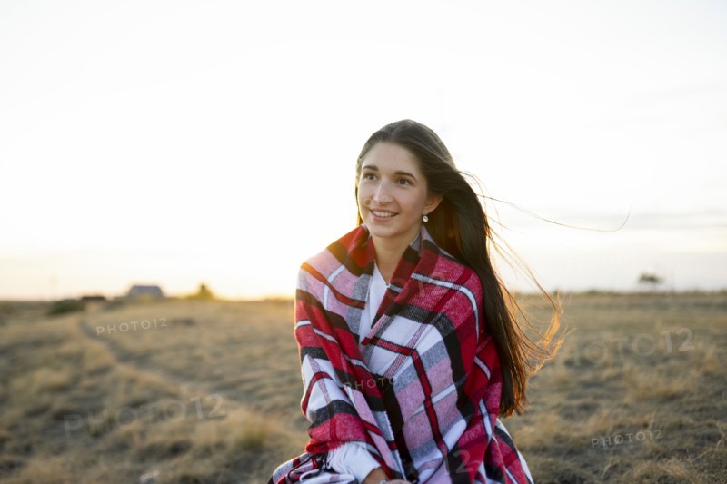 Portrait of smiling woman wrapped in scarf