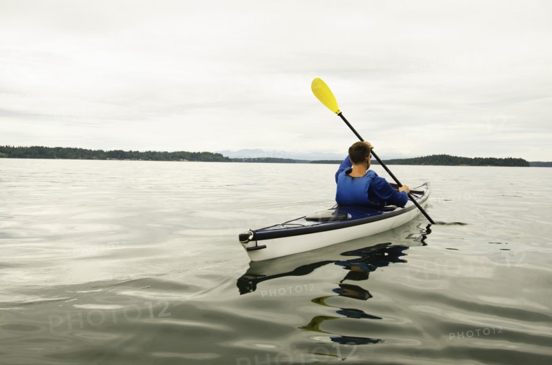 Man kayaking on lake