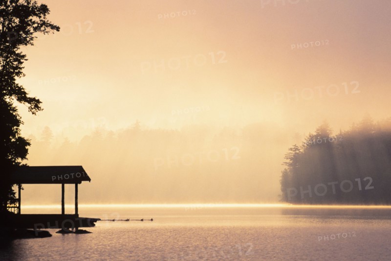 Morning mist above Lake Placid at sunrise in Adirondack Mountains, Lake Placid, New York, USA