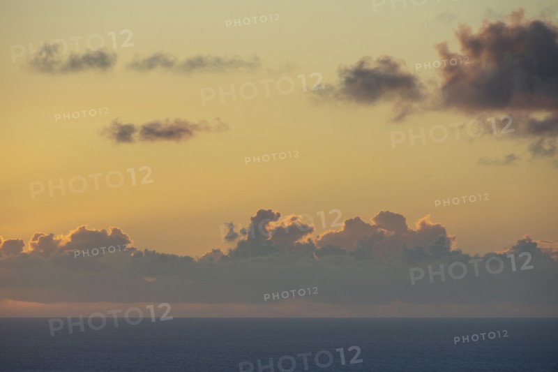 Clouds above calm ocean at sunrise, St. John, United States Virgin Islands, USA