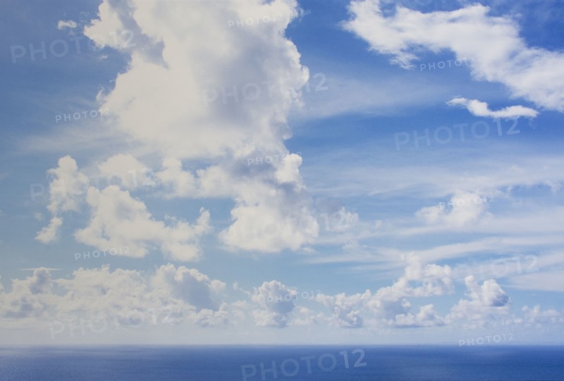 White puffy clouds above calm sea, St. John, United States Virgin Islands, USA