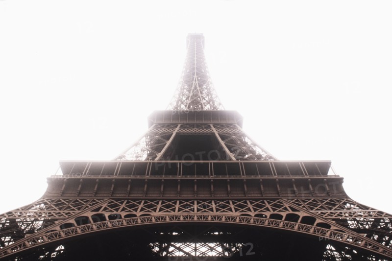Low angle view of Eiffel Tower in mist, Paris, , France