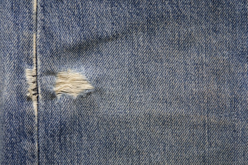 Close-up of worn jeans, New York, NY, USA