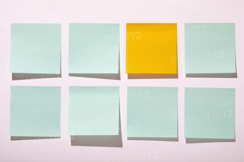 Rows of blank adhesive notes on white background, New York, NY, USA