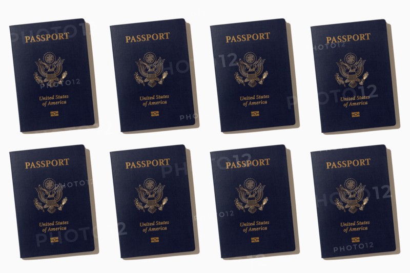 Rows of American passports on white background, New York, NY, USA